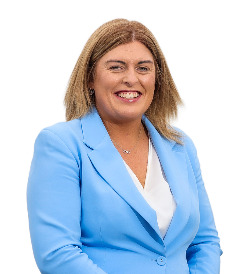 Head and shoulders shot of a smiling<br />
person wearing a bright blue jacket over a white top